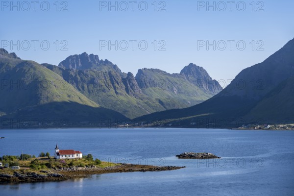 Small church Sildpollnes Kirke at the fjord Austnesfjorden, idyllic Norwegian fjord landscape, Sildpollen, Nordland, Norway, Europe