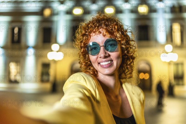Beauty woman millennial taking selfie in the city at night