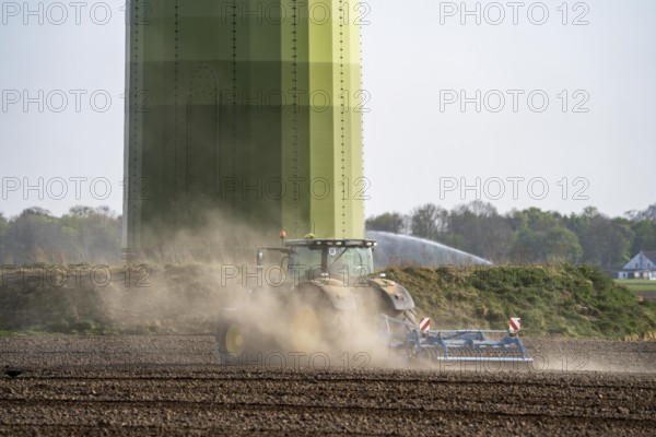 A tractor works a field, due to long dryness in spring, no rain for more than 4 weeks, the fields are dusty, near Kerken, Lower Rhine, North Rhine-Westphalia, Germany, Europe