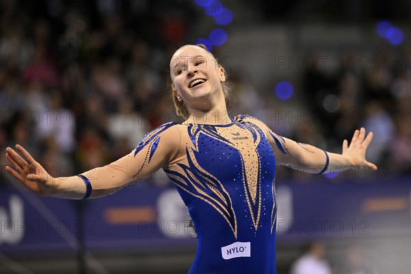 Silja Stöhr GER cheers after her routine on the balance beam Gymnastics action, EnBW DTB-Pokal, Porsche-Arena, Stuttgart, Baden-Württemberg, Germany, Europe