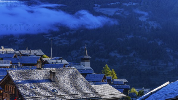 Roofs covered with hoarfrost, fog rising, Grimentz, Val d'Anniviers, Valais Alps, Canton Valais, Switzerland, Europe