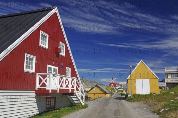 Colourful Scandinavian houses along a quiet street under a blue sky, old town of the capital of Greenland, Nuuk, Greenland, Denmark, North America