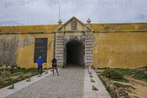 Sagres, Algarve, Portugal - Entrance gate to the Fortaleza de Sagres, fortress of Sagres. The Fortaleza de Sagres fortress is located on the 1, 000 metre long and 300 metre wide Ponta de Sagres headland. It is a Portuguese national monument and tourist attraction