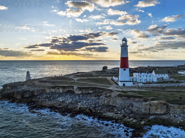 Sunset over Portland Bill Lighthouse from a drone, Portland Bill, Isle of Portland, Dorset, England, United Kingdom, Europe