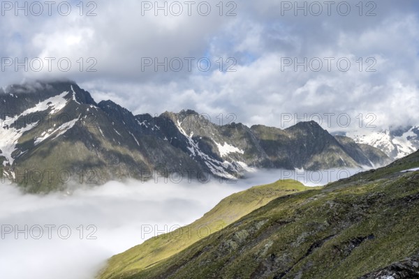 High fog in the valley, behind mountain peaks high above the clouds, Berliner Höhenweg, Zillertal Alps, Tyrol, Austria, Europe