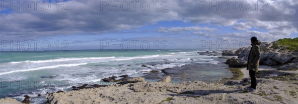 Man standing on the coast watching the sea, De Hoop Nature Reserve, nature reserve near Struisbaai, Garden Route, Western Cape, South Africa, Africa