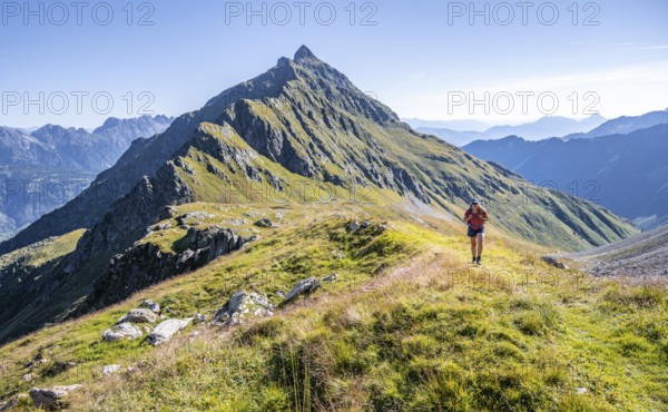 Hiker on hiking trail, Carnic Main Ridge, Carnic High Trail, Carnic Alps, Carinthia, Austria, Europe