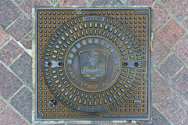 Manhole cover with the coat of arms of Wismar, Wismar, Mecklenburg-Vorpommern, Germany, Europe