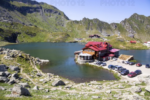 Romania: Lake Balea (Romanian: Balea Lac) from above. The lake is located at the summit of the Transfogarasch High Road in the Fogarasch Mountains on the border between Transylvania and Wallachia and is a popular excursion destination