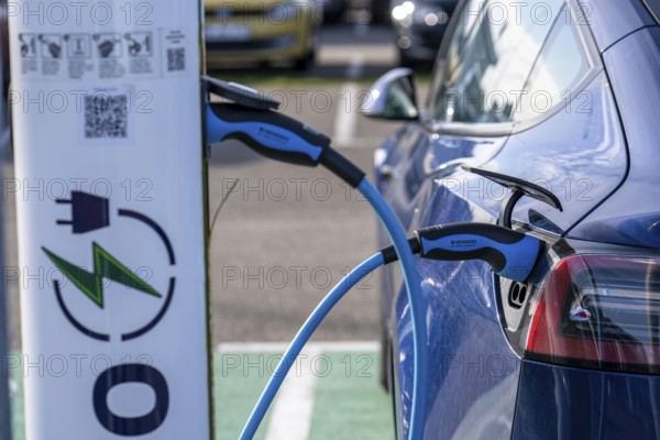 Electric car fast charging station, from the Dutch provider PowerGo, in the ferry harbour of Eemshaven, powered by renewable energy, Netherlands