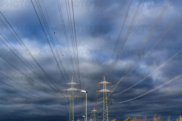 High-voltage pylons, overhead lines, with warning paint for air traffic, near Krefeld, North Rhine-Westphalia, Germany, Europe