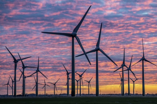 Wind farm near the East Frisian town of Norden, east of the town, sunset, Lower Saxony, Germany, Europe