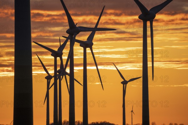 Wind farm near the East Frisian town of Norden, east of the town, sunset, Lower Saxony, Germany, Europe