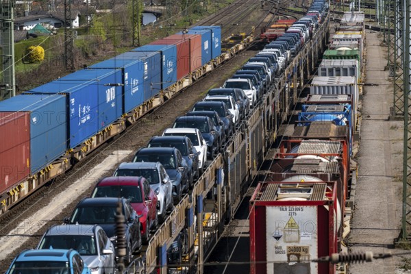 Duisburg-Rheinhausen freight station, at the Logport harbour area, goods trains loaded with new cars, various tank containers and the container train from China, on its way to the Logport, part of the new Silk Road, Duisburg, North Rhine-Westphalia, Germany, Europe
