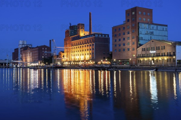 The inner harbour, in Duisburg, Küppersmühle building, and Werhahn Mill, granary with Explorado Children's Museum, right, North Rhine-Westphalia, Germany, Europe