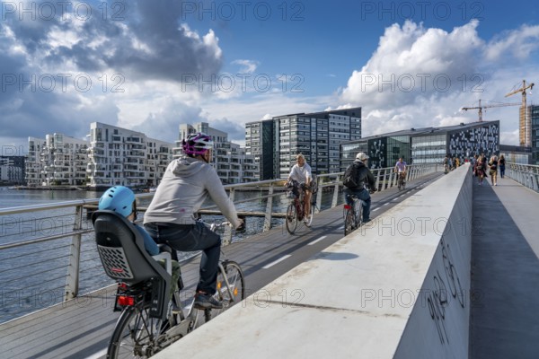 Cyclists on the Bryggebroen cycle and footpath bridge over the harbour, Sydhavnen, Copenhagen is considered the cycling capital of the world, 45 % of the population travel by bike, Denmark, Europe