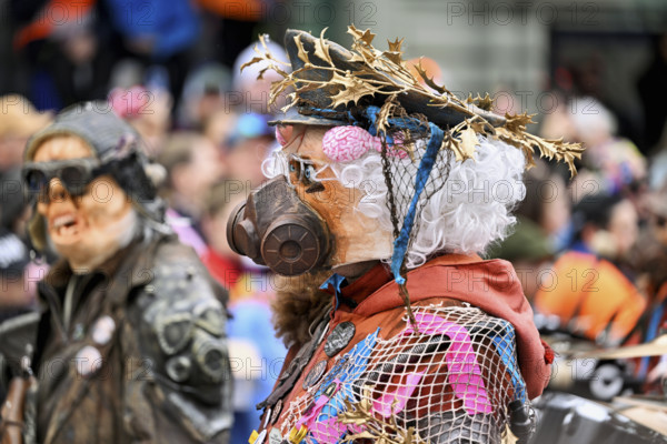 Person dressed up as a soldier with a gas mask at the Wey guild on Rose Monday, Güdismäntig, Lucerne Carnival 2024, Lucerne, Switzerland, Europe