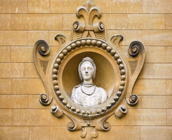 Holford family bust portrait in wall of Westonbirt House and School, Tetbury, Gloucestershire, England, UK