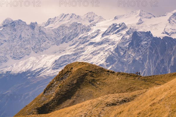 Alpine landscape with snow-covered peaks and a hiking trail in the foreground, Planplatten, Switzerland, Europe
