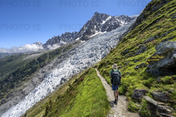 Hiking on the trail to La Jonction, Glacier des Bossons, behind the summit of the Aiguille du Midi, Chamonix, Haute-Savoie, France, Europe