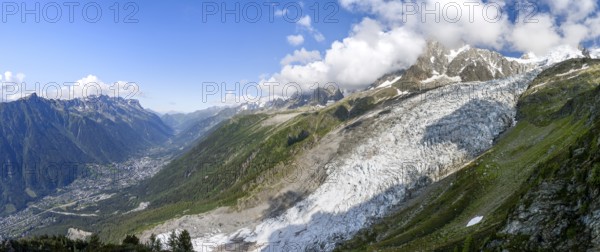 Panorama, mountain landscape with glacier Glacier des Bossons and summit of the Aiguille du Midi, view into the valley with village, Chamonix, Haute-Savoie, France, Europe
