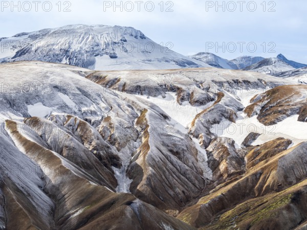 Early snow on the colorful rhyolite mountains, Landmannalaugar, Fjallabak Nature Reserve, Iceland, Europe