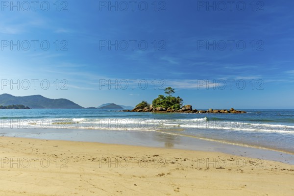 Small rocky islet on Bonete beach in Ilhabela on the coast of Sao Paulo, Bonete beach, Ilhabela, Sao Paulo, Brazil, South America