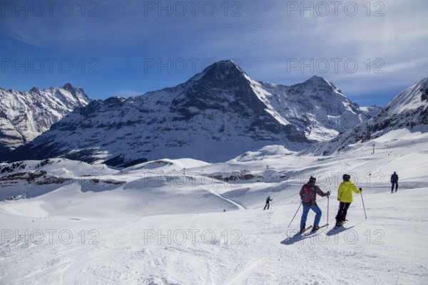 25 March 2024: Skiing against the backdrop of the north face of the Eiger in Grindelwald, Switzerland, Europe