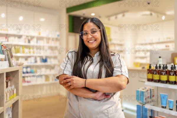 Portrait of a proud young female pharmacist standing in the store
