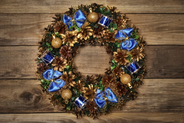 Christmas wreath on wooden background