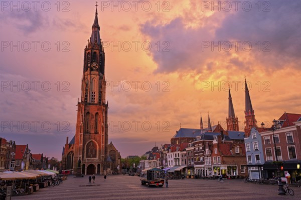 Delft, Netherlands, May 12, 2017: Nieuwe Kerk New Church protestant church on Delft Market Square Markt with dramatic sky on sunset. Delft, Netherlands