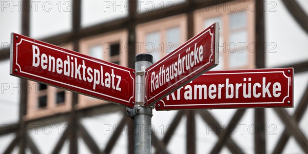 Red street signs in front of half-timbered houses in the old town, Erfurt, Thuringia, Germany, Europe