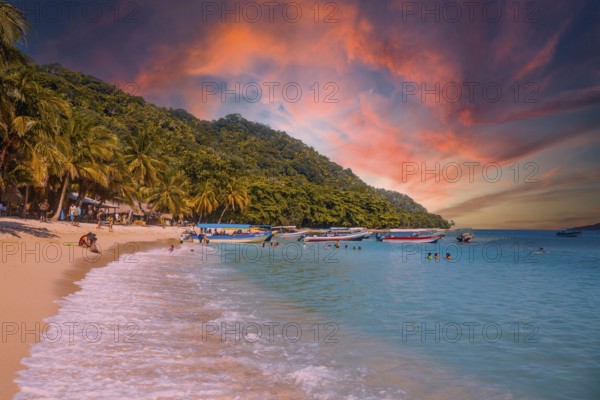 Tela, Honduras, January 2020: Local transport boats at Cocalito beach in Punta de Sal on the Caribbean Sea at sunset, Tela, Central America