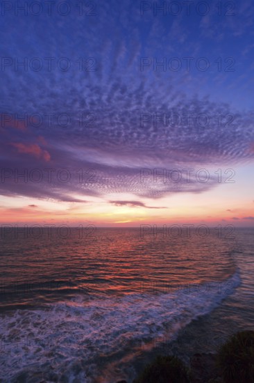 Ocean sunset on rocky coast. Varkala resort, Kerala, India, Asia