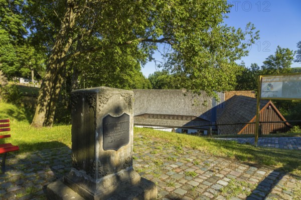 Memorial stone commemorating the beginning of tin mining in this region. An outstanding monument complex is the mining museum with its various viewing areas, which offer visitors a complete overview from underground ore extraction to ore processing in the ore washes above ground:The Neubeschert-Glück-Stollen, originally excavated in 1802 for exploratory purposes, now serves as a museum show tunnel, Altenberg, Altenberg, Saxony, Germany, Europe