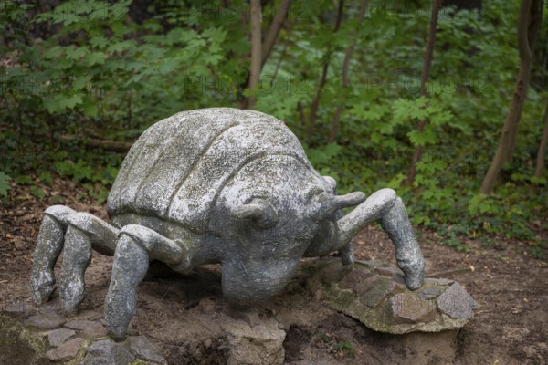 A phylloxera sculpture adorns the Historic Forest Route. Mia Stolle, a student of theatre sculpture at the Dresden University of Fine Arts, created the sculpture from polymer concrete. The phylloxera catastrophe, which peaked in 1904, led to the systematic uprooting and burning of the vines and their stakes. It was only with the grafting of European noble vines onto phylloxera-tolerant American rootstocks that a systematic revival began. The first vineyard in Saxony was replanted in 1907, phylloxera in large format on the wine trail, Radebeul, Saxony, Germany, Europe