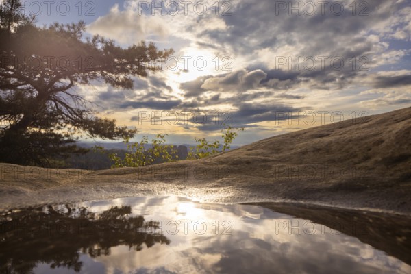 View from the Carolafelsen the sky is reflected in a puddle, Bad Schandau, Saxony, Germany, Europe