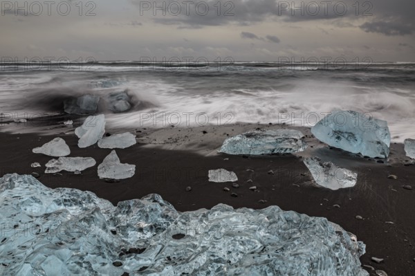 Ice floes on the beach, waves, sea, clouds, winter, Diamond Beach, Breidamerkursandur, Jökulsarlon, Iceland, Europe