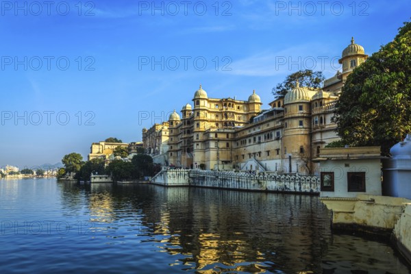 Romantic India luxury tourism concept background, Udaipur City Palace and Lake Pichola. Udaipur, Rajasthan, India, Asia
