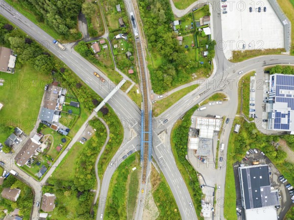 Aerial view of a road crossing with railway bridge in urban surroundings, track construction, rail delivery for Hermann Hessebahn, Calw, Black Forest, Germany, Europe