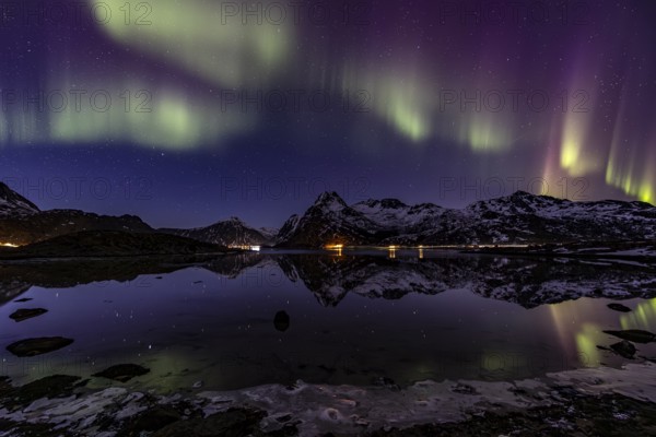 Northern lights over fjord, steep mountains, winter, aurora borealis, Flakstadoya, Lofoten, Norway, Europe