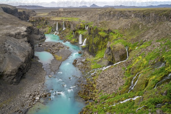 Waterfalls and a turquoise blue river flowing through a canyon, Sigöldugljúfur, long exposure, Icelandic highlands, Iceland, Europe