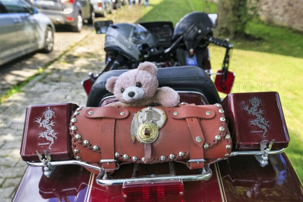 Motorbike with panniers and teddy bear parked at the roadside, Kawasaki, retro, Lower Saxony, Germany, Europe
