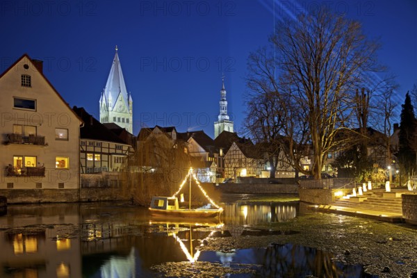 Large pond, St. Patrokli Cathedral and St. Peter's Church in the evening during winter sunshine, Old Town, Soest, North Rhine-Westphalia, Germany, Europe