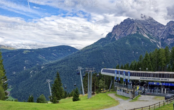 Middle station of the Kreuzjochbahn cable car, Stubai Alps near Telfes and Fulpmes, high mountains of the Alps, weather mood, cloud mood, Tyrol, Austria, Europe
