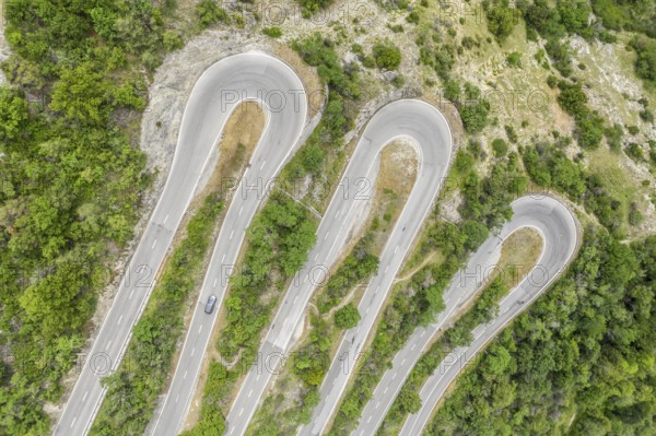 Aerial view, drone shot, Mountain pass road with multiple hairpins, water pipeline, Switzerland, Europe