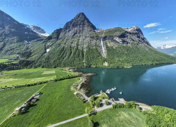 Aerial panoramic view over fjord Hjorundfjord, at village Oye, marina, waterfall, mt. Stalbergneset, Norway, Europe