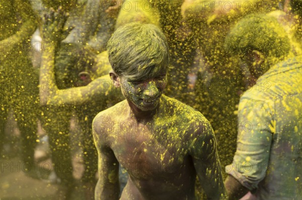 Revellers dancing in the beat of music as they celebrate Holi on a street, the Hindu spring festival of colours on March 25, 2024 in Guwahati, Assam, India. Holi, also known as the Festival of Colors or the Festival of Spring, is one of the most vibrant and joyous festivals in India