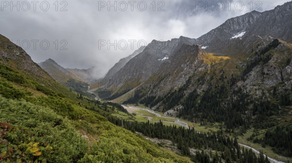 Green mountain valley with river and steep mountain peaks, Chong Kyzyl Suu Valley, Terskey Ala Too, Tien-Shan Mountains, Kyrgyzstan, Asia