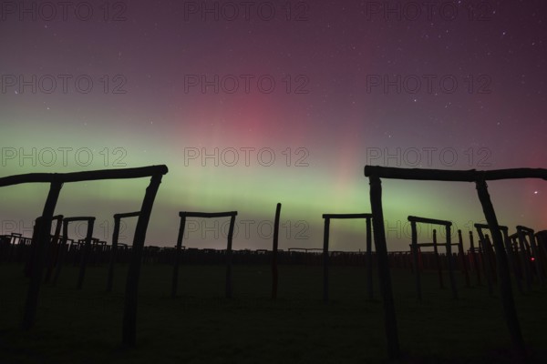 Northern lights (aurora borealis) over the ring sanctuary of Pömmelte, prehistoric circular ditch complex, also known by archaeologists as the German Stonehenge, Pömmelte, Saxony-Anhalt, Germany, Europe